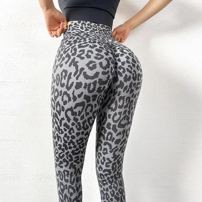 Pantalon de yoga femme taille haute avec effet galbant pour les fessiers, tissu respirant à motifs pois, coupe slim courte avec poches pratiques, et finition évasée pour un style moderne et confortable.
