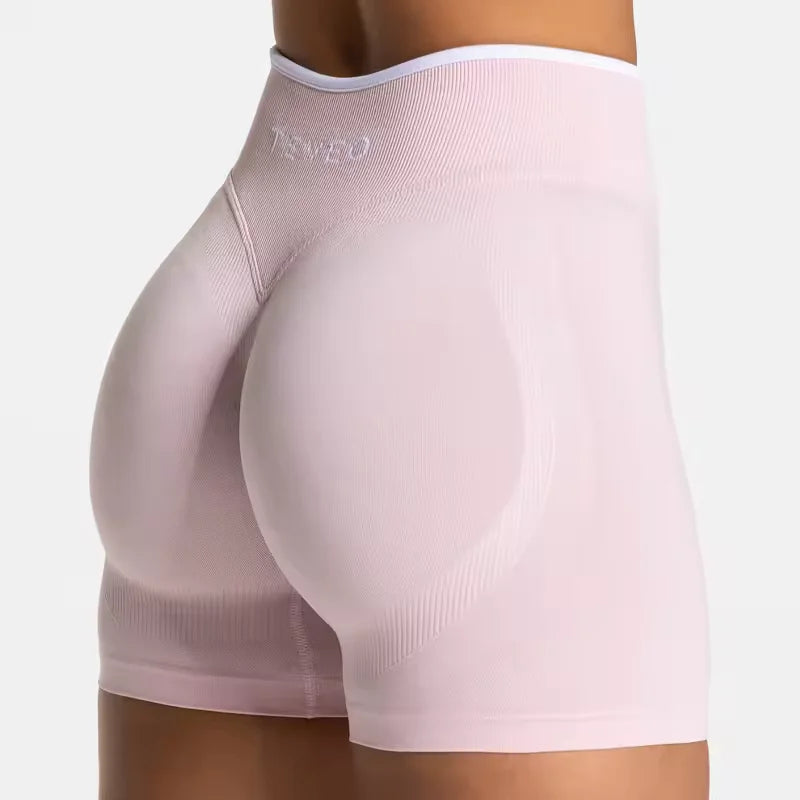 Short de sport femme TEVEO – Taille haute gainante, coupe sans couture, tissu sculptant pour sublimer les hanches. Parfait pour le fitness, le yoga, le running ou la salle de sport