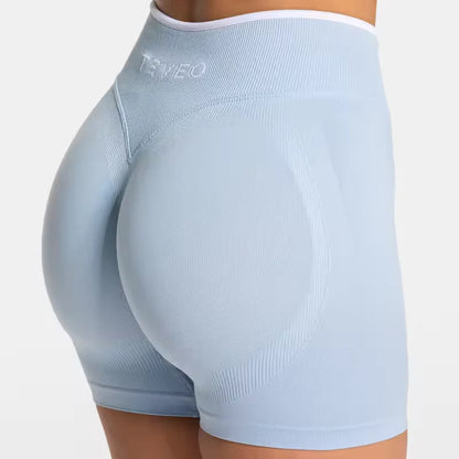Short de sport femme TEVEO – Taille haute gainante, coupe sans couture, tissu sculptant pour sublimer les hanches. Parfait pour le fitness, le yoga, le running ou la salle de sport