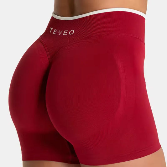 Short de sport femme TEVEO – Taille haute gainante, coupe sans couture, tissu sculptant pour sublimer les hanches. Parfait pour le fitness, le yoga, le running ou la salle de sport